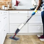 Black woman doing house chores